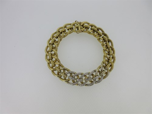 Lot 305 - Cartier - A gold and diamond set bracelet