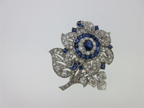 Lot 261 - A sapphire and diamond flower brooch