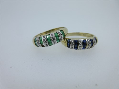 Lot 145 - A pair of matching gold and gem set rings