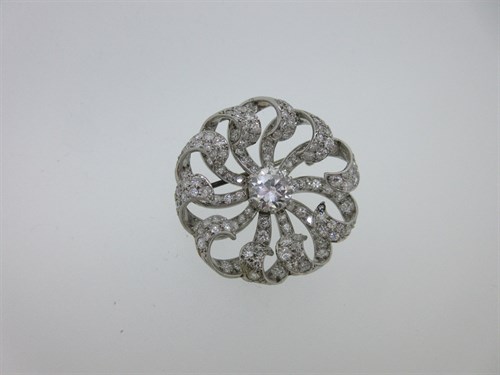 Lot 289 - A diamond Catherine wheel brooch