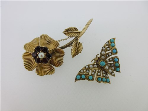 Lot 157 - Two gold and gemset brooches - a butterfly and a wild rose