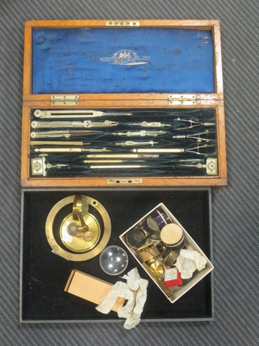 Lot 91 - An oak box containing drawing instruments and...