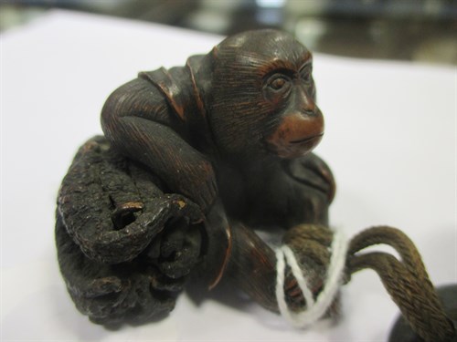 Lot 104 - Two wooden netsuke , Meiji period One of them...