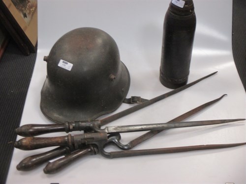 Lot 132 - A WW1 period German helmet with original green...