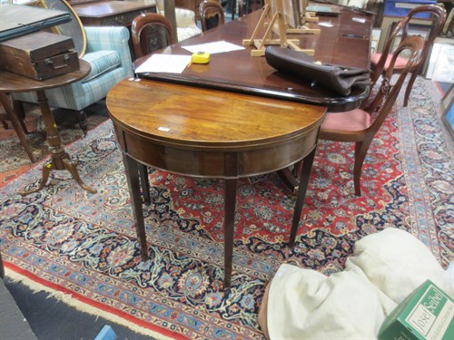 Lot 369 - A George III mahogany demi-lune card table,...
