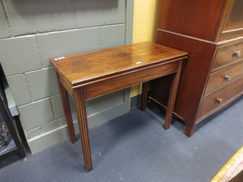 Lot 340 - A George III mahogany rectangular tea table,...