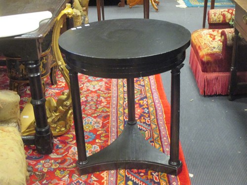 Lot 575 - A 19th century French black painted circular...