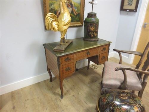 Lot 383 - A Rococo style leather topped desk with brass...