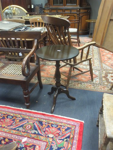 Lot 390 - An oak circular tripod table, stamped Ercol