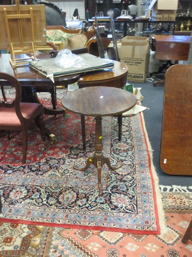 Lot 399 - A 19th century mahogany tripod table