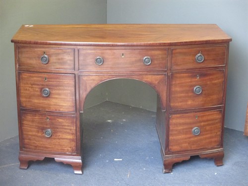 Lot 379 - A Regency mahogany bow front dressing table,...
