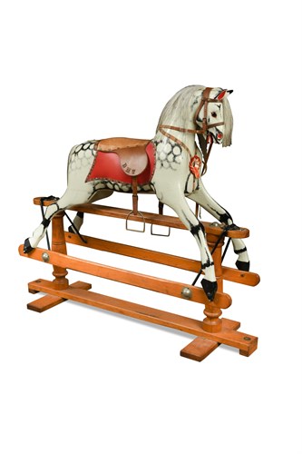 Lot 575 - A 20th century painted wood rocking horse on stand