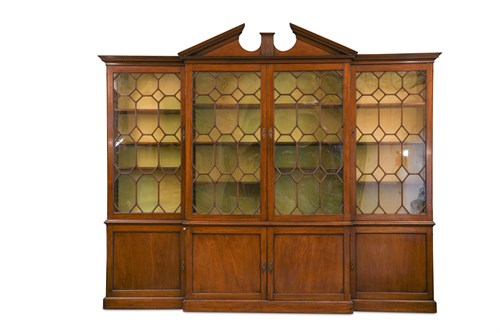 Lot 456 - A George III mahogany breakfront library bookcase