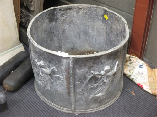 Lot 458 - A circular lead planter with repeating angel...