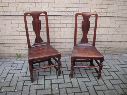 Lot 529 - A pair of 18th century elm panel seat chairs...