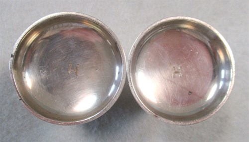 Lot 646 - A pair of Edward VII silver pepper casters