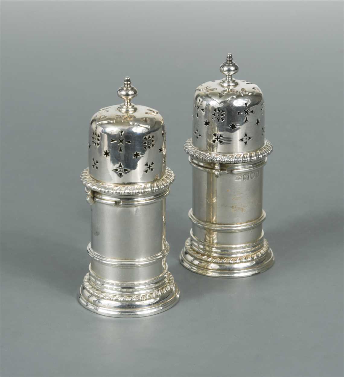 Lot 646 - A pair of Edward VII silver pepper casters