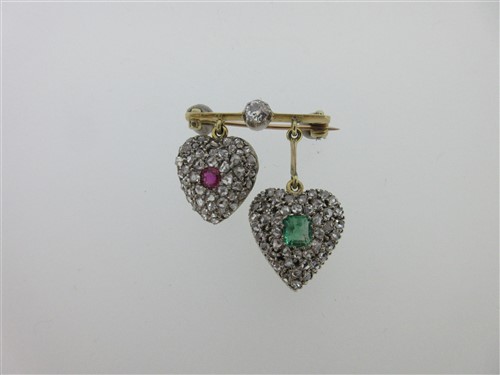 Lot 265 - A miniature bar brooch with two pendant heart lockets set with diamonds and coloured gems