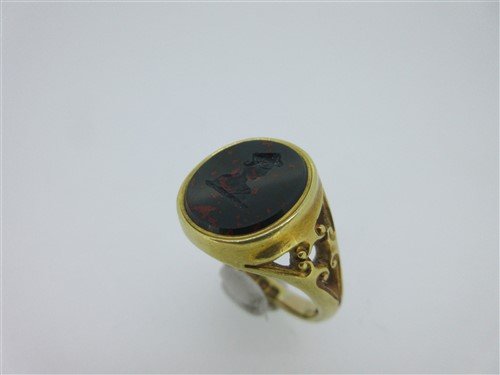 Lot 144 - An antique 18ct gold signet ring set with a seal engraved bloodstone