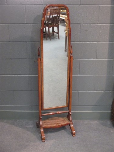 Lot 599 - A 1930's walnut framed cheval dressing mirror...