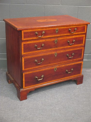Lot 617 - A George III mahogany and crossbanded chest of...