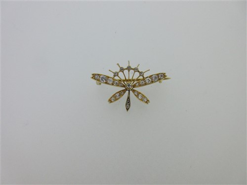 Lot 115 - A diamond set moth brooch