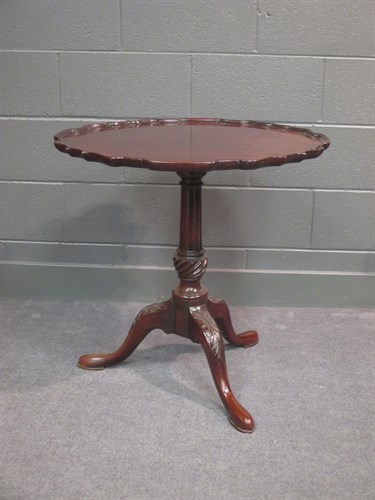 Lot 614 - An 18th century mahogany pie crust tilt top...