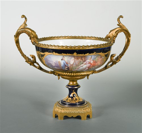 Lot 20 - A late 19th century porcelain and gilt metal mounted two-handled pedestal bowl