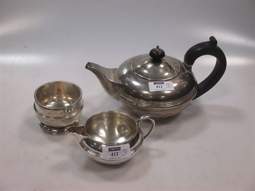 Lot 412 - A silver teapot together with a silver milk...