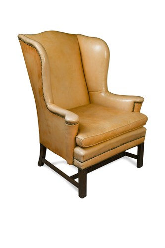 Lot 485 - A George III mahogany framed wing armchair