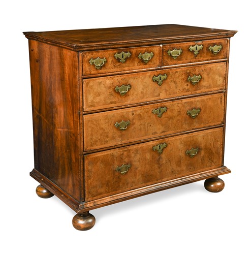 Lot 428 - A Queen Anne walnut chest of drawers