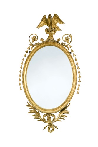 Lot 457 - A pair of George III oval gilt framed mirrors