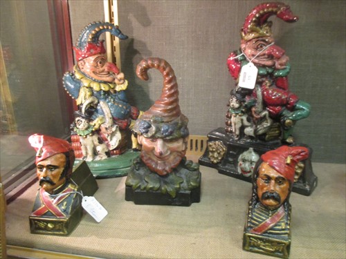 Lot 15 - Six later cast iron painted door stops, (6)