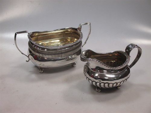 Lot 416 - A silver cream jug and a silver sugar bowl...