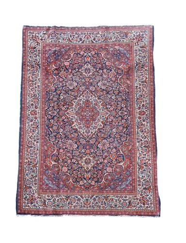 Lot 464 - A Kashan blue ground rug