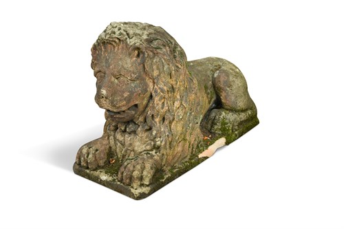 Lot 585 - An 18th century sandstone garden figure of a recumbent lion