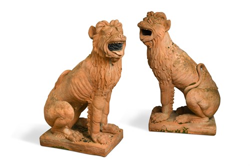 Lot 590 - A pair of 20th century terracotta garden figures of seated Lion Dogs