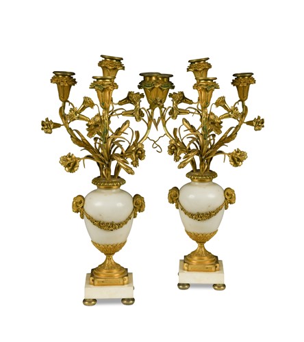Lot 305 - A pair of white marble and ormolu four light candlestick urns