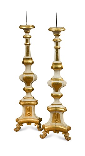 Lot 306 - A pair of 18th century Italian painted and parcel gilt pricket candlesticks
