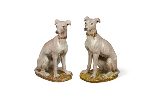 Lot 369 - A large pair of modern tin glazed terracotta figures of guard hounds