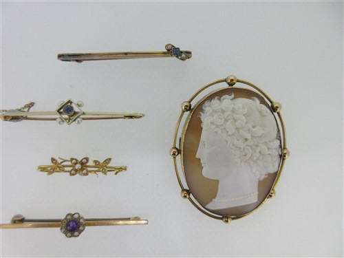 Lot 225 - A shell cameo brooch together with a quartet of gem set bar brooches