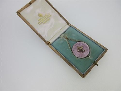 Lot 92 - An enamel and seed pearl pendant in original fitted case