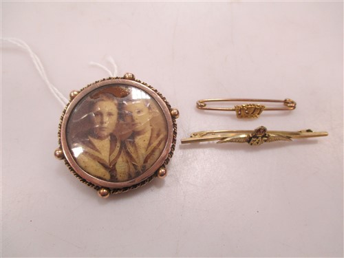 Lot 203 - Two sweetheart brooches together with a locket...