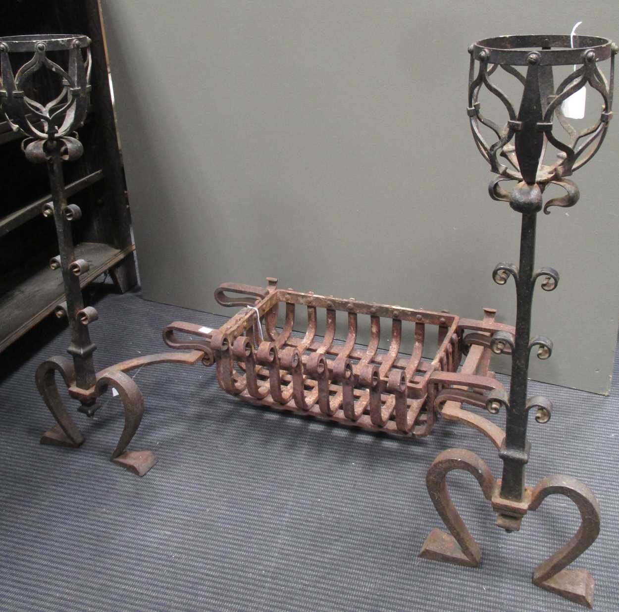 Lot 713 - An Arts & Crafts fire basket and andirons