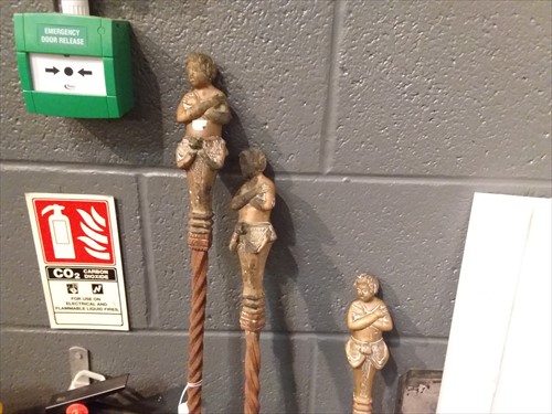 Lot 368 - Three long-handled steel fire irons with brass putto terminals