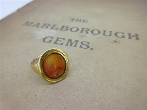 Lot 120 - A carved cornelian intaglio ring, probably Roman