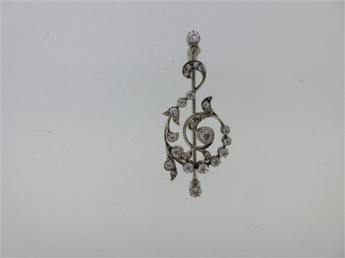 Lot 153 - A diamond brooch in the form of a treble clef