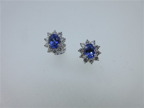 Lot 254 - A pair of tanzanite and diamond earstuds