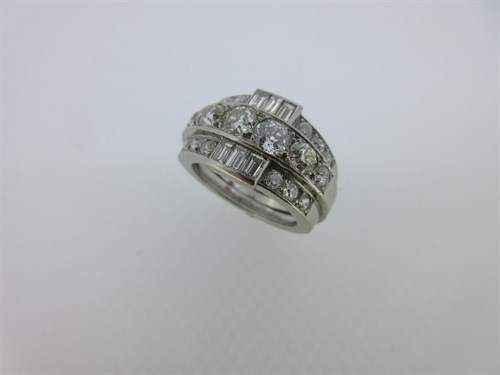 Lot 198 - A diamond three row band ring