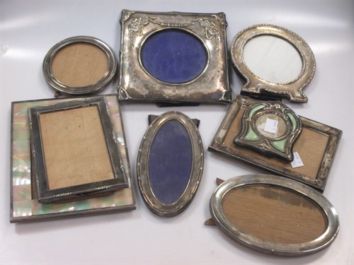 Lot 389 - A collection of 9 silver easal backed...